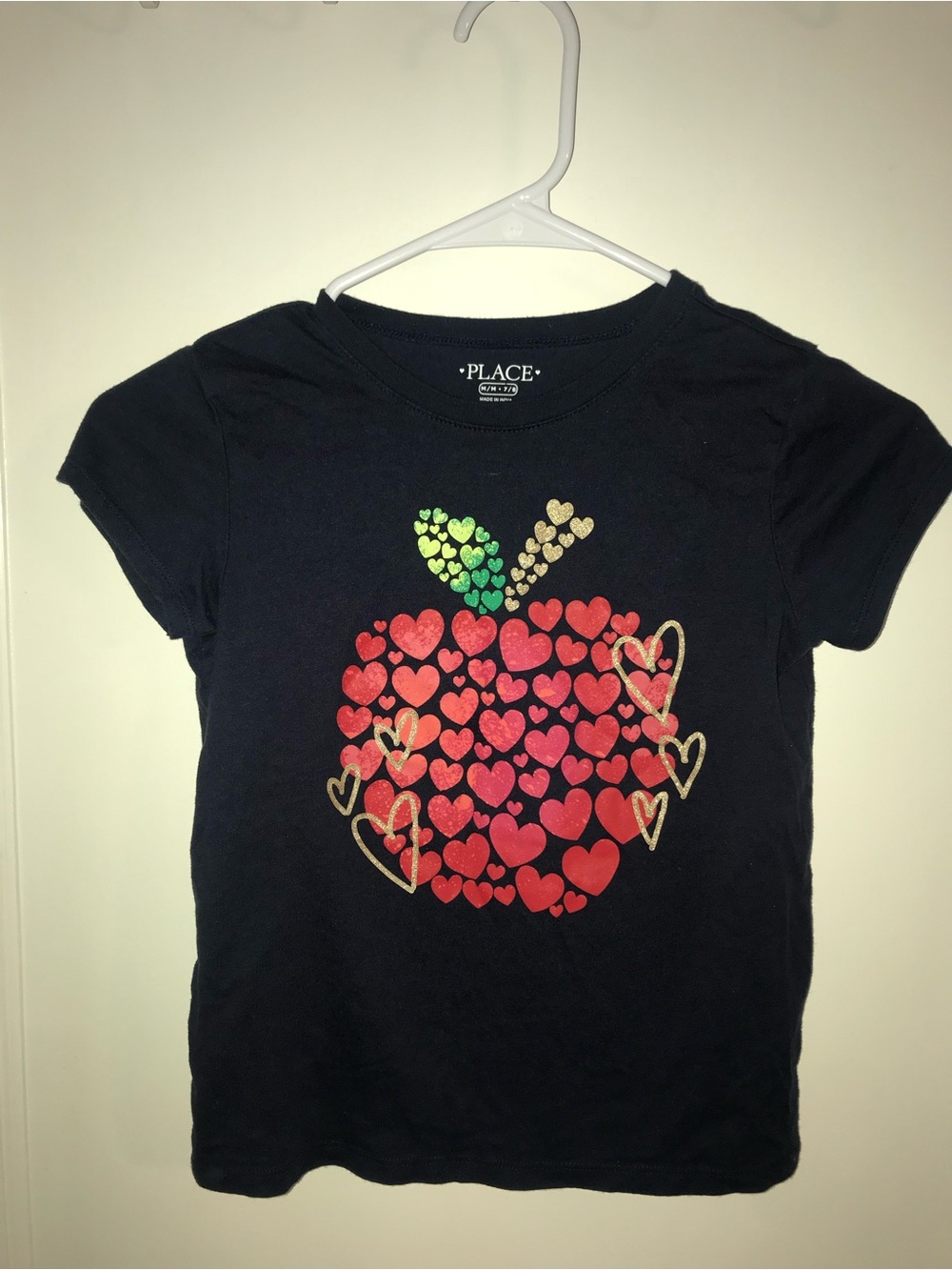 Place Black Tee with Red Heart Apple and Gold Accents